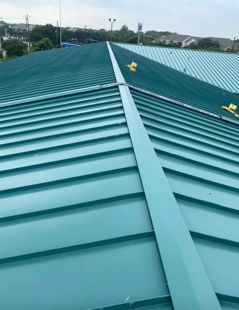Green commercial metal roof ridge and valley for Metal Roof Repair in San Elizario